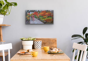 Original oil painting by Oksana Johnson of two women in traditional Japanese kimonos walking in an ornamental park with autumn leaves and other fall foliage. On wall, above a kitchen table with cups, food, and two chairs.