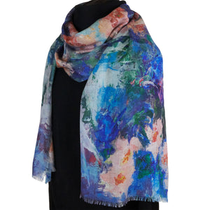 Long cashmere-silk scarf with floral design by Oksana Fine Art and Design, based on an impressionist painting of pink orchids with a light green and blue background, worn over a black sweater, 5. 210x70 cm, 82x27 inches