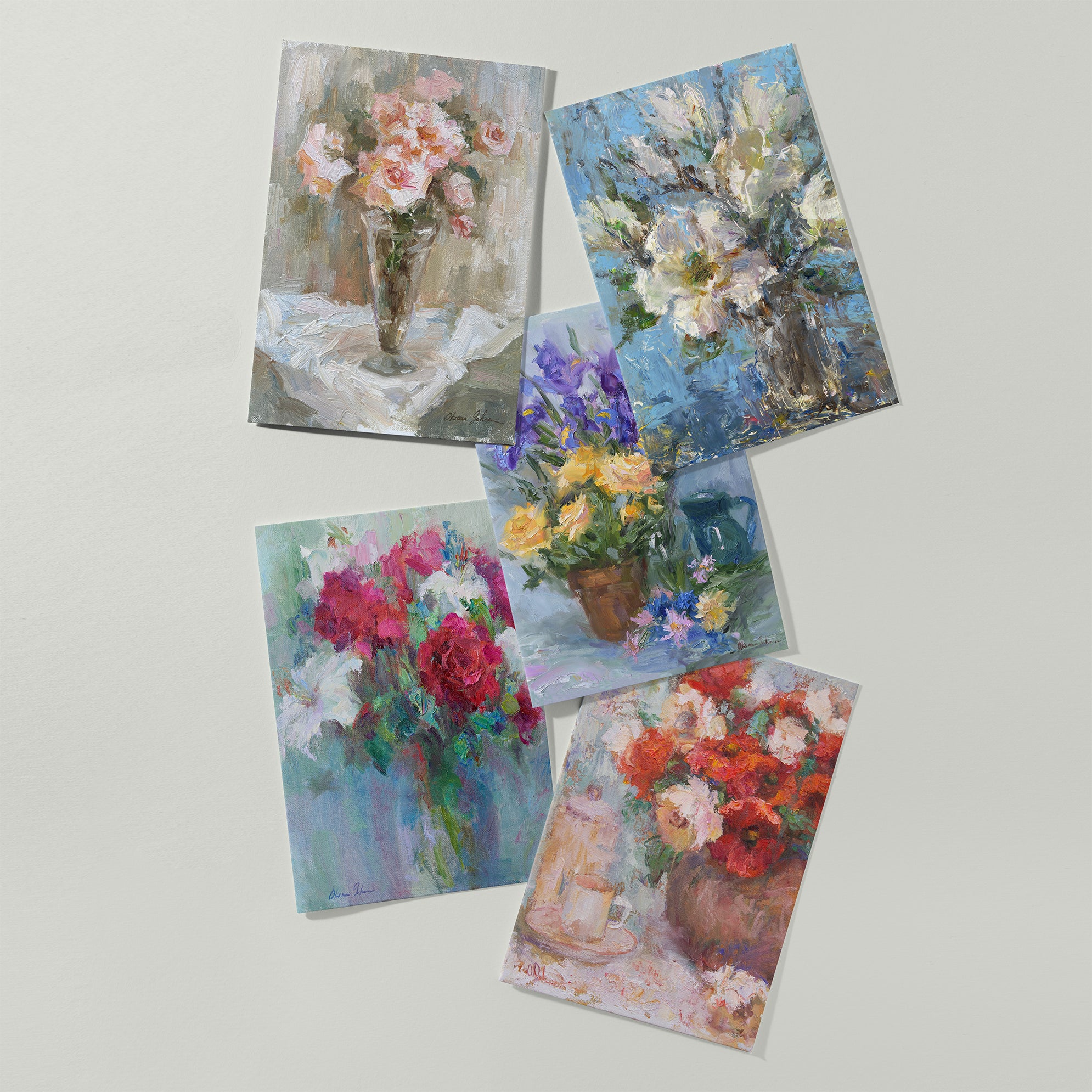 Floral fine art greeting card set 5x7, five cards displayed on background, including roses, magnolias, irises, and other flowers, based on original still-life oil paintings by Oksana Johnson