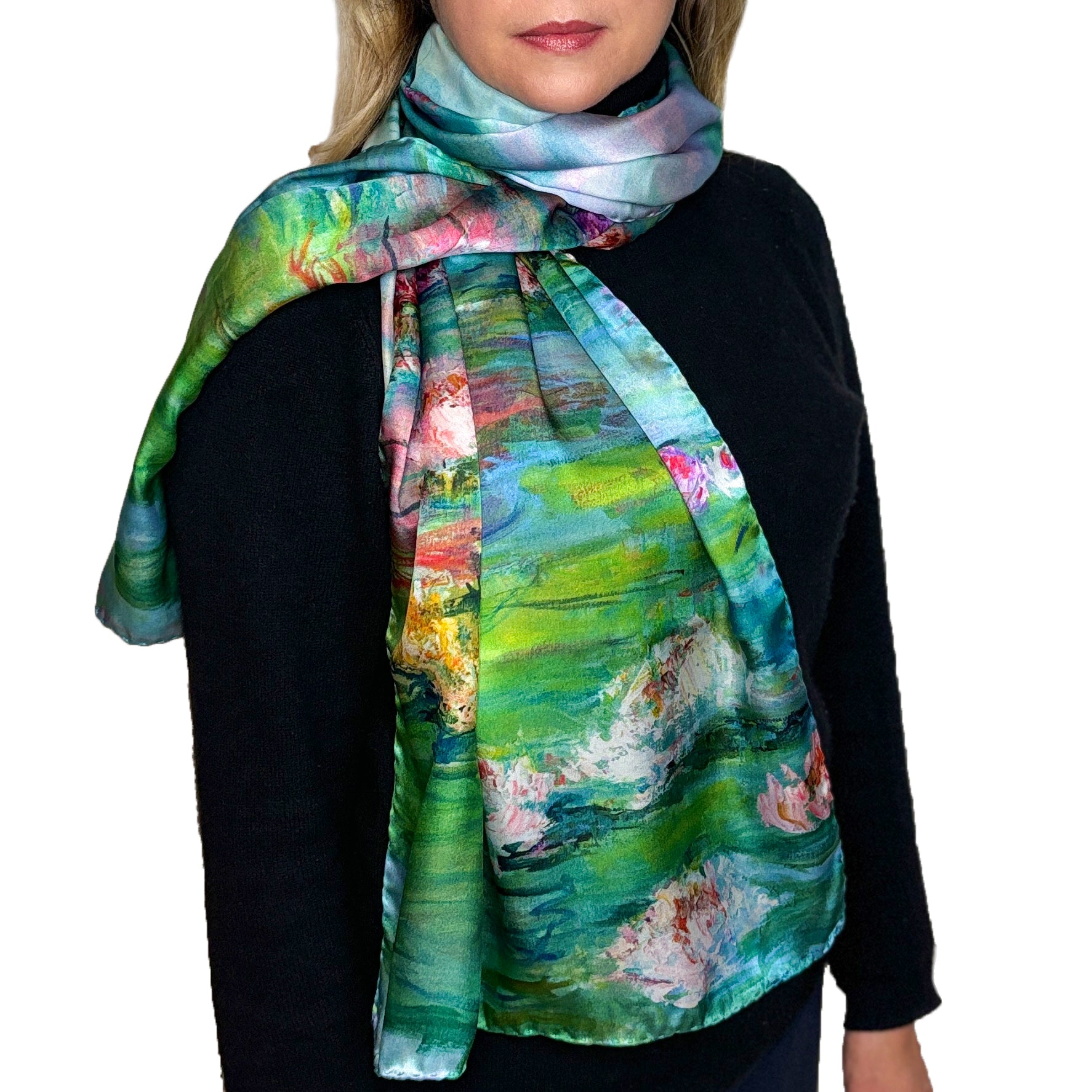 Woman in black wearing a long silk scarf with pink and white water lilies on a green and blue background, Waterlily Radiance, from Oksana Fine Art and Design