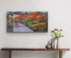 Original oil painting by Oksana Johnson of two women in traditional Japanese kimonos walking in an ornamental park with autumn leaves and other fall foliage. In room, above a long table with vases and flowers.