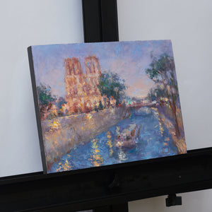 Oksana-Johnson-original-oil-painting-Twilight-in-Paris-9x12-inches-Notre-Dame-Seine-River-boat-on-easel