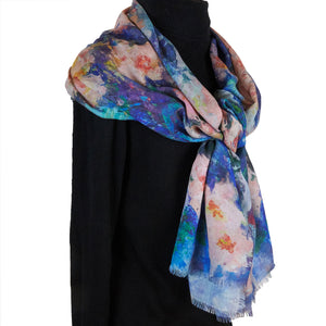 Long cashmere-silk scarf with floral design by Oksana Fine Art and Design, based on an impressionist painting of pink orchids with a light green and blue background, worn over a black sweater, 4. 210x70 cm, 82x27 inches